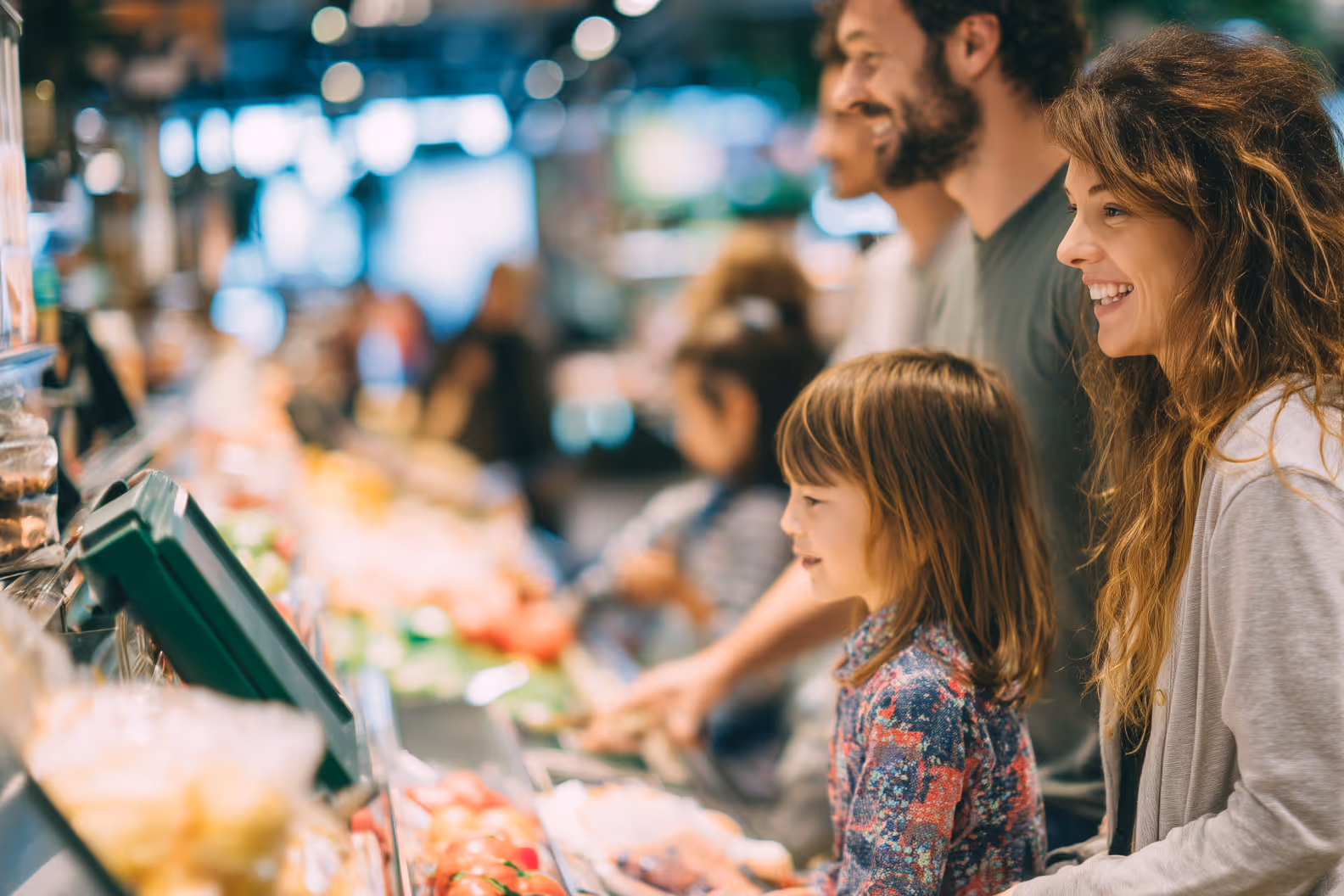 Family of 3 in grocery store